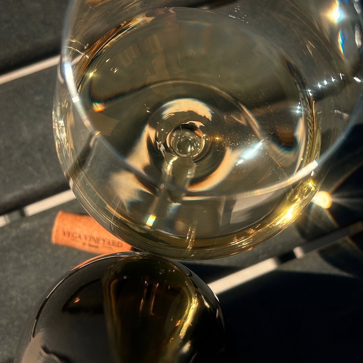 Wine glasses photographed from above with dramatic lighting